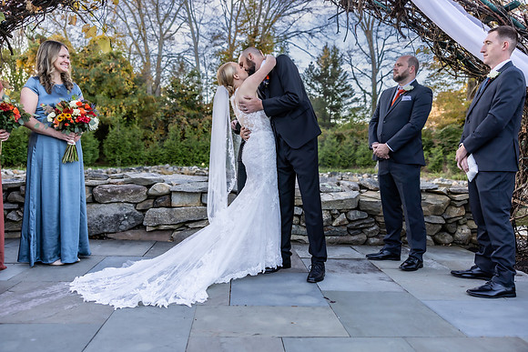 Romatic wedding couple kissing after saying I do at Salem Herb Farm